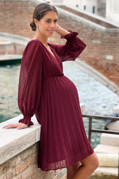 Festive maternity dress in a wrap style with a pleated skirt in burgundy
